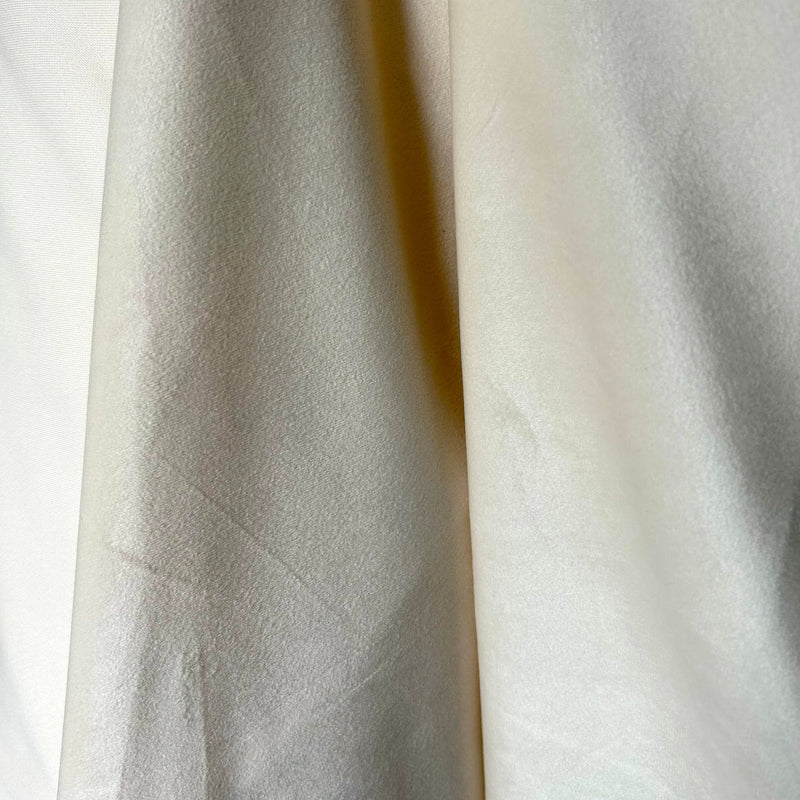 Close-up of textured white fabric with a subtle pattern