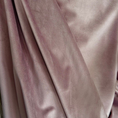 Close-up of pink velvet fabric with a soft texture