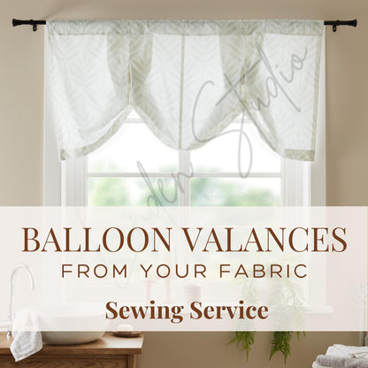 Balloon valances hanging above a window with text about sewing service.