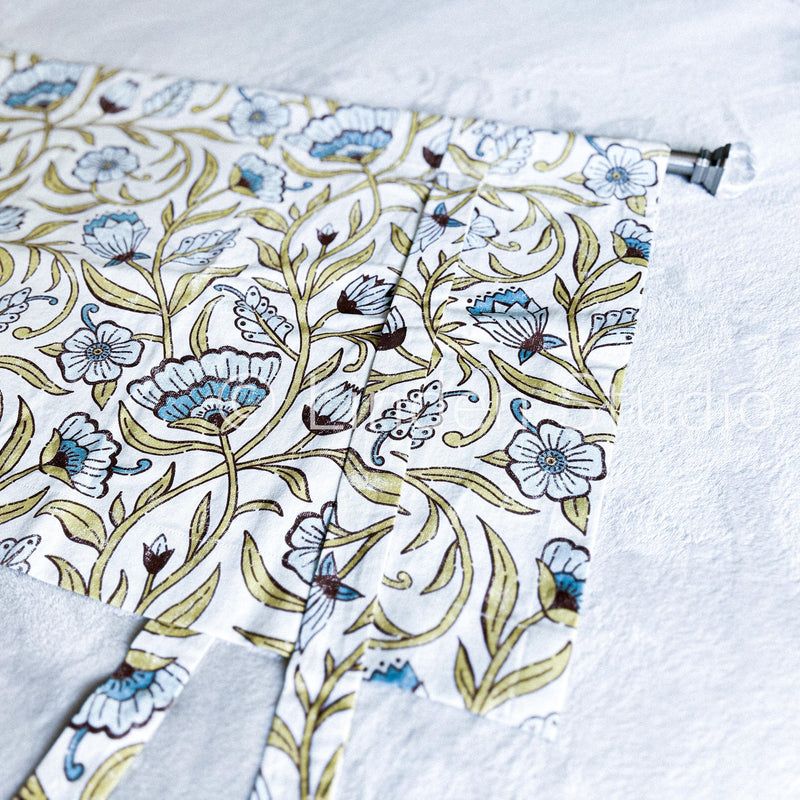 Floral patterned fabric with a visible brand name on a white background