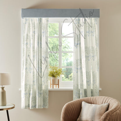 Sheer curtains with a floral pattern in a living room setting.