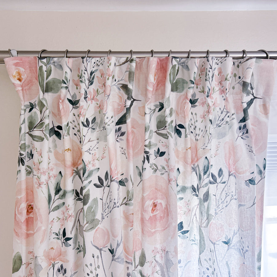 Floral loose pleat curtains hanging from rings